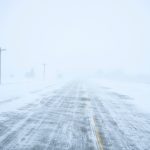 Snow blows and drifts over County Road K22 near Merrill, Iowa, on Friday, Jan. 12, 2024. (AP Photo/Carolyn Kaster)