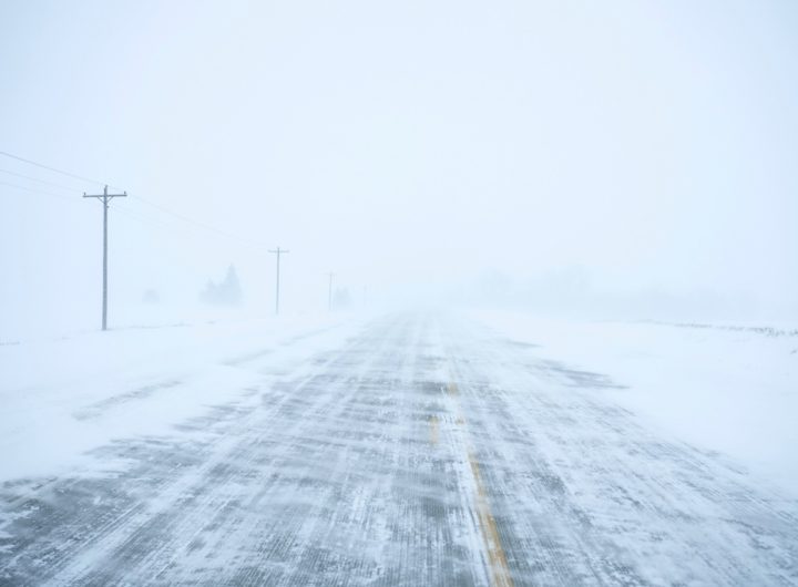 Snow blows and drifts over County Road K22 near Merrill, Iowa, on Friday, Jan. 12, 2024. (AP Photo/Carolyn Kaster)